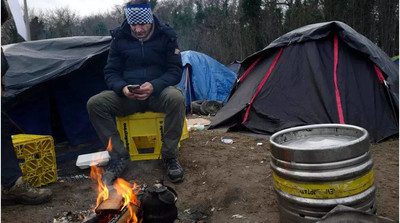 Photo prise dans un camp de migrants à Calais, le 15 janvier 2019 (image d'illustration). AP - Michel Spingler 