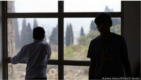Des enfants dans un centre pour mineurs isolés à Athènes, en Grèce. Crédit : Picture-alliance